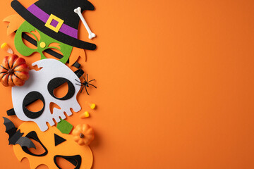Halloween-themed arrangement featuring colorful masks, pumpkins, candy, and Halloween decorations...