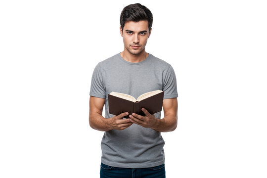 Young man in casual clothes holding and reading an open book while looking forward, isolated on transparent background