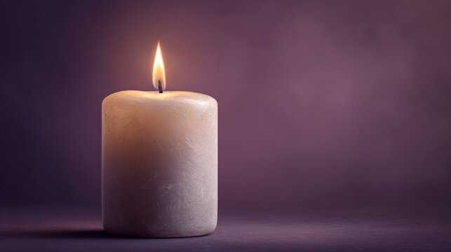 Glowing candle in dim room with purple background