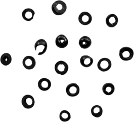A collection of small black rubber washers arranged in a scattered pattern.