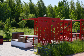 Modern Outdoor Pavilion Featuring an Artistic Design Set Amidst a Lush Green Environment