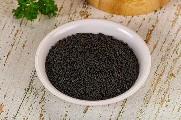 Black dry Nigella seeds in the bowl
