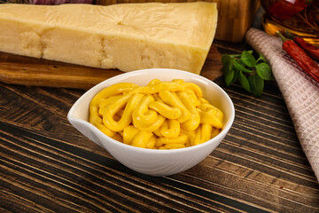 Yellow cheese sauce in the bowl