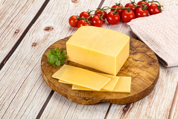 Yellow cheese piece with slices