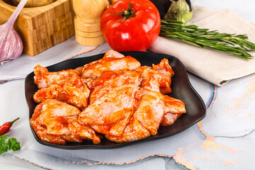 Raw marinated uncooked chicken wings