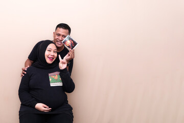 Cheers and smile with showing usg photo