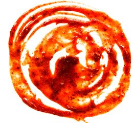 A swirl of spicy red sauce, likely used as a condiment or ingredient in various dishes.