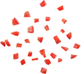 A collection of small, diced red pieces resembling chopped tomatoes, arranged randomly on a white background.