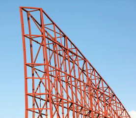 A red structure with a blue sky in the background