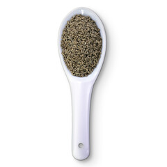 A white spoon filled with small, dark seeds, likely used for cooking or seasoning.