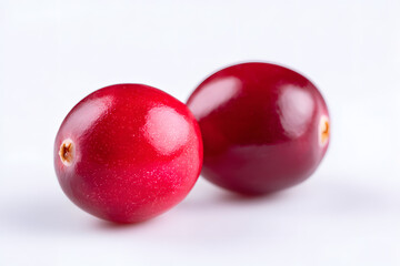 Fresh cranberries isolated on white background. Perfect for holiday designs, food blogs, and packaging.