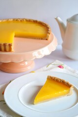 Fototapeta premium Side View Lemon Tart Pastel Peach Cake Stand White Porcelain