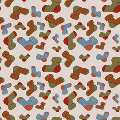 Cozy seamless pattern of warm wool socks in autumn colors. Perfect for seasonal backgrounds, holiday gift wrap, stationery, and home decor.