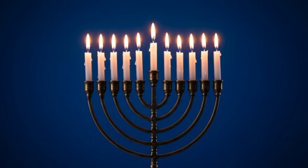 Fototapeta premium Lit Menorah with Nine Candles Traditional Hanukkah Symbol Festive Holiday Celebration