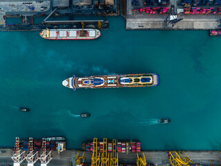luxury cruise ship for first class passenger is sailing in of the port, at morning aerial view