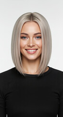 Woman with sleek platinum blonde bob haircut on gray background. Professional hair cutting and coloring demonstration for salon bleaching and precision styling services
