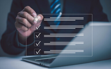 Businessman checklist concept as clipboard document checklist form on the virtual screen Use your...