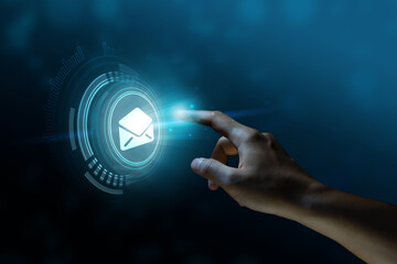 The finger is pointing or pressing a mail button on digital screen. icon, display screen, touch screen.