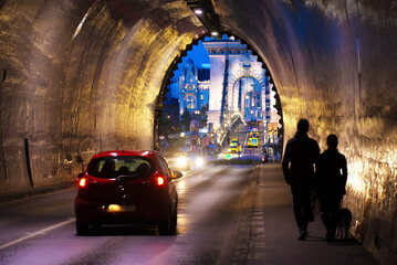 People in the tunnel, chain bridge