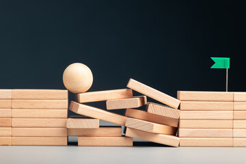 The ball balances on unstable blocks, symbolizing effort and persistence through a rough part of...
