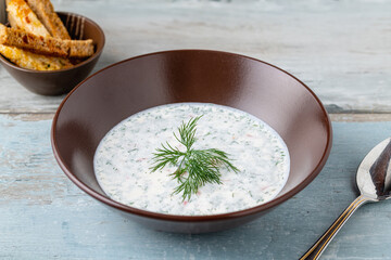 Cold yogurt soup with cucumber, dill, and fresh herbs