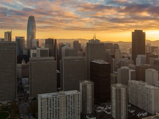 San Francisco, USA, skyline at sunset. The Salesforce Tower dominates the cityscape, surrounded by...