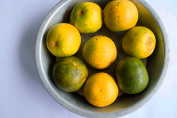 fresh lemon slice, orange slice, jeruk baby, citrus sinensis, green lemon, yellow lemon in white...