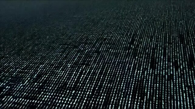 A dark background displays a flowing stream of binary code numbers