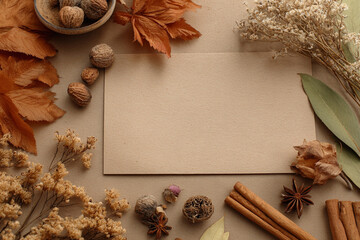 Autumn themed mockup with a background for lettering and text input on kraft paper, surrounded by autumn leaves
