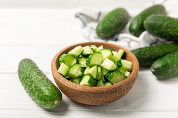 Cucumber on wooden background. Slice of cucumber on background. Fresh organic green cucumbers...
