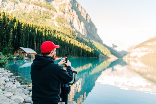 Young man vlogging at Lake Louise in Banff National Park