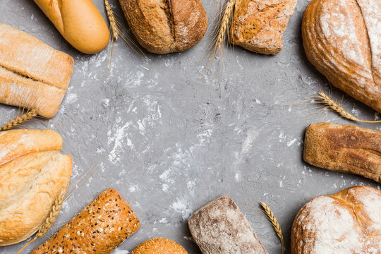 Homemade natural breads. Different kinds of fresh bread as background, top view with copy space