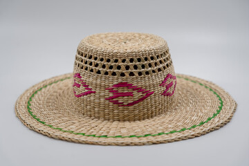 Antique straw hat made of natural materials isolated on white background