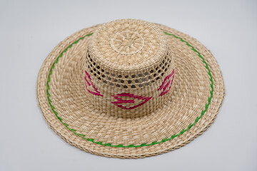 Antique straw hat made of natural materials isolated on white background