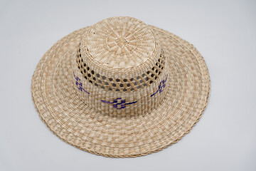 Antique straw hat made of natural materials isolated on white background