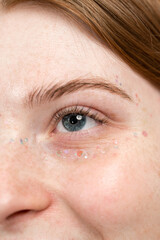 Fototapeta premium Portrait of woman with glitter around her eyes