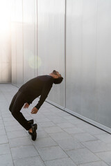 Man leaning back with glare around him