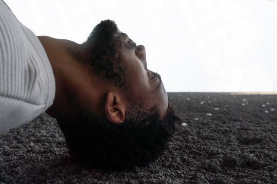 Thoughtful Man Leaning Against a Wall