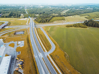 Aerial view of a highway interchange connecting City in Europe, providing efficient transportation...