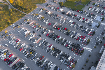 Aerial shot of busy parking lot near a mall