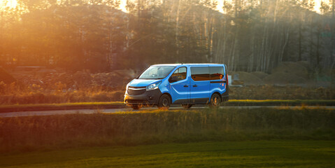 Delivery van on road with natural scenery
