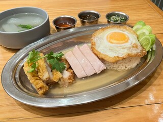 Hainanese chicken rice with sous-vide chicken and fried chicken, served with a fried egg