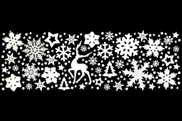 Xmas banner white reindeer, snowflakes, trees, stars, decorations, ornate festive design on black background. Abstract style for Christmas holiday season.