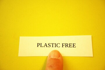 Plastic free subtitle or text on paper with hand and copy space.