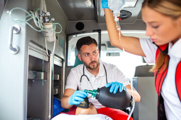 EMS Paramedics Team Provide Medical Help to Injured Patient on the Way to Healthcare Hospital....