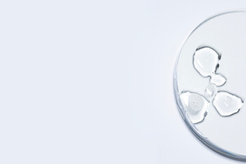 A crystal-clear droplet on white background with copy space for infographic to market place, serum toner cream swatch texture