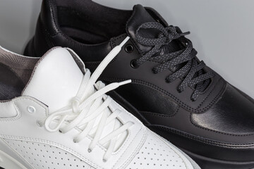 Lacings of black and white leather classic sneakers, fragment