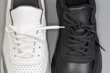 Lacings of black and white leather classic sneakers, fragment