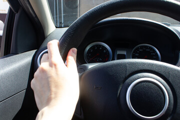 car interior, manual gearbox, hand on steering wheel, car dashboard, driver, driving a car