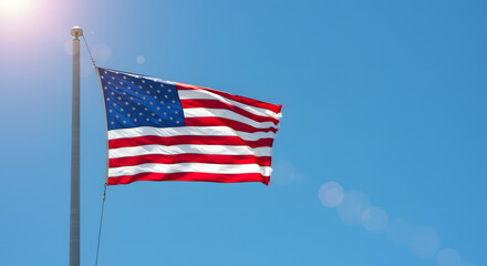 Obraz premium Waving American flag under bright daylight representing liberty and United States heritage
